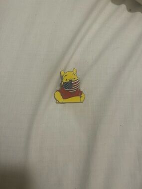 Disney Winnie the Pooh Yellow Enamel Pin with American Flag Mask